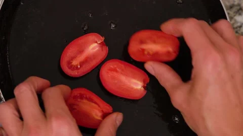 Chef puts tomatoes in pan in restaurant kitchen. Stock Footage 142216645