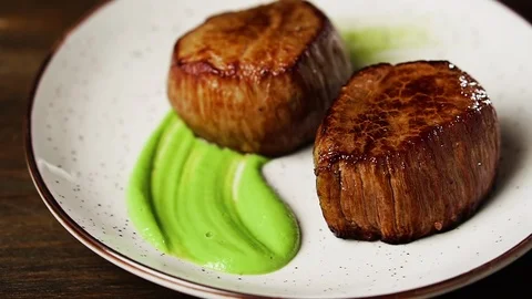Chef puts two filet mignon steaks on a plate. 動画素材 126223065