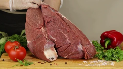 The chef puts two pieces of beef pulp Stock Footage 122171274