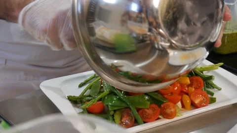 Chef puts a vegetable salad in dish Video stock 108311035