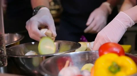 Chef puts vegetables in a bowl Stock Footage 67862808