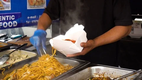 Chef puts very good noodles in the basket of paper Stock Footage 78080985