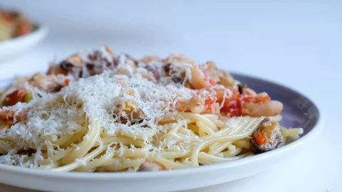 Chef putting basil leafes, cooking italian pasta with sea food. Stock Footage 118387769