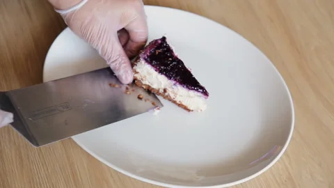 Chef putting cake slice on plate Stock Footage 91414854