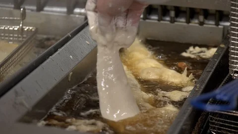 Chef putting fish in deep fat fryer Video stock 101341632