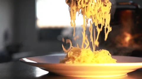 Chef putting out mashed potato to a plate in restaurants kitchen Stock Footage 230080490