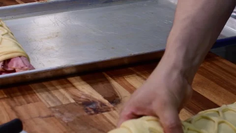 Chef is putting pan de jamon bread on the baking tray for fermentation Stock Footage 335433928