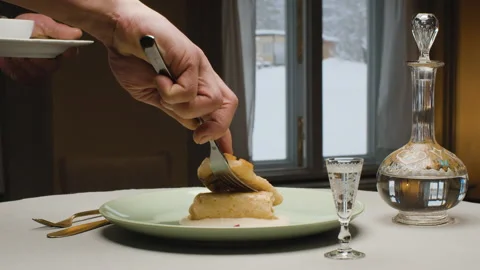 Chef putting a piece of fish on a plate with pancake Stock Footage 147545615