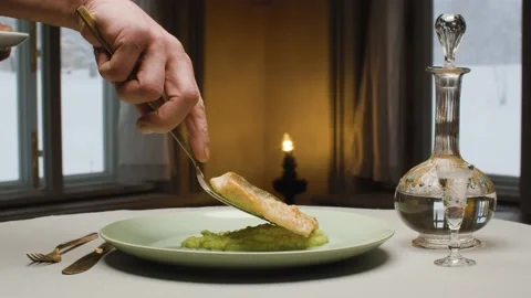 Chef putting a piece of fish on a plate Stock Footage 148016036