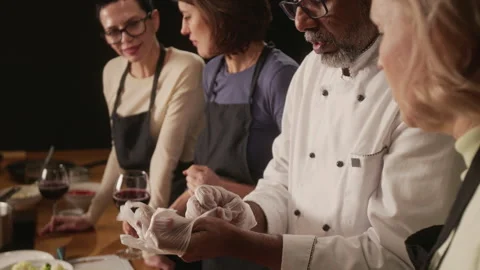 Chef Putting On Plastic Gloves Before starting cooking master class Stock Footage 332572299