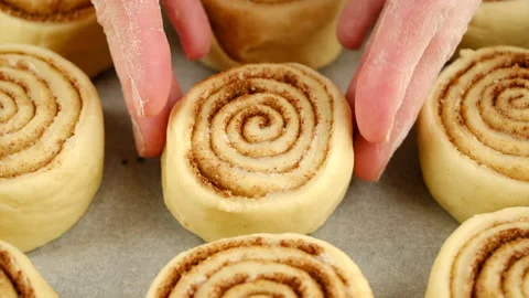 Chef putting put the raw bun on the baking paper Stock-Footage 233164284