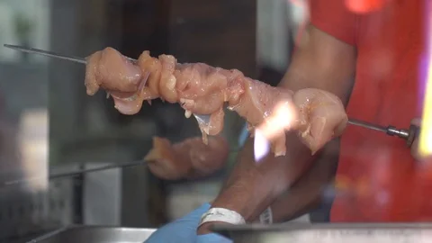 Chef is putting raw meat on grill. Barbecue meat preparing on grill, close up. Stock Footage 93962115