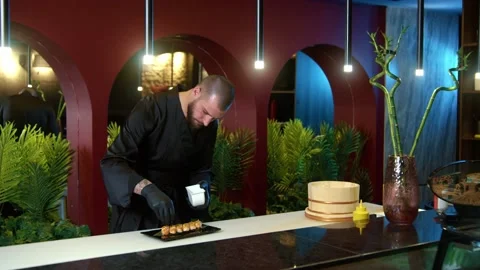 Chef Putting Roe red Sushi Caviar On Top Of Shrimp Tempura Sushi Stock Footage 239097397
