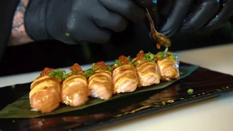 Chef Putting Roe red Sushi Caviar On Top Of Shrimp Tempura Sushi Stock Footage 239099496