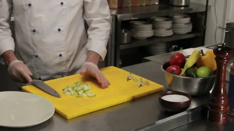 Chef putting sliced apple on a plate, medium shot 動画素材 66075812