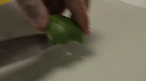 Chef putting sliced lime into the plate, close up Stock Footage 66061214