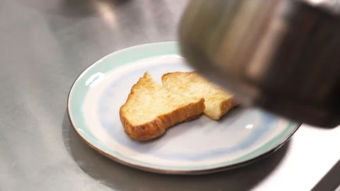 A chef putting spinach on bruschetta. Variation of eggs benedict cooking. Stock Footage 105494778