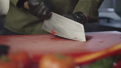 The chef quickly cuts the hot pepper into small pieces. Stock Footage 232373283