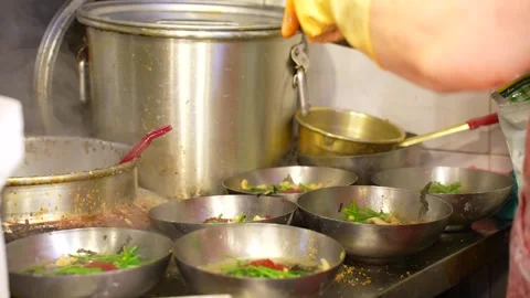 Chef Quickly Cutting Dough into Traditional Korean Kalguksu Video stock 321672037
