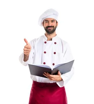 Chef reading a book Stock Photos