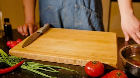 The chef is ready to prepare a new dish. Close-up of cutting board and man's Stock Footage 205014580