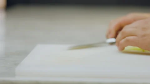 Chef Removes Apple Slices with Knife on Chopping Board in Close Up. Stock Footage 321384650