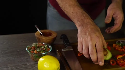 Chef Removes an Avocado Pit Stock Footage 243605898