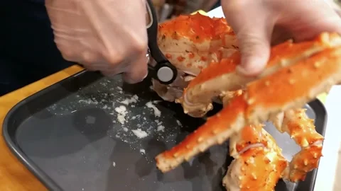 Chef removes cooked king crab meat Stock Footage 171736513