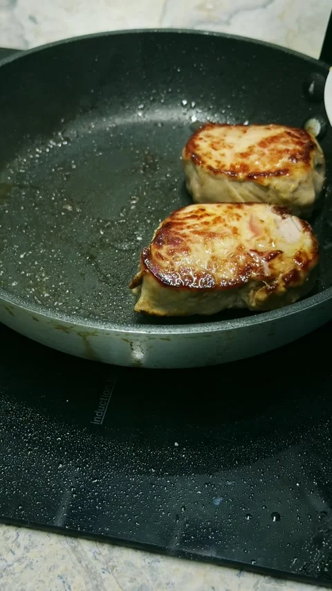 Chef Removing Cooked Pork Tenderloin Medallions from Frying Pan Close Up 4K Stock Footage 337797257