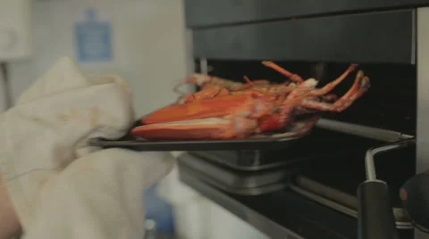 Chef removing lobster from grill Stock Footage 58431475