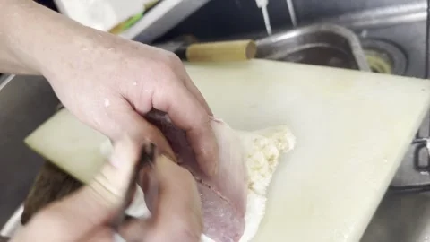 Chef Removing Pin Bones From Horse Mackerel Fillet With Tweezers Close Up Stock-Footage 338261312