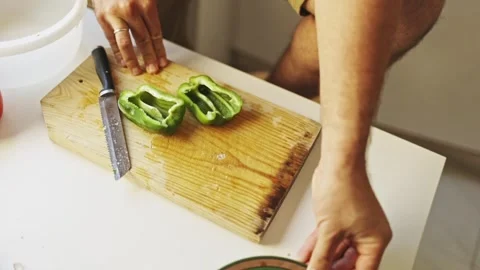 Chef removing seeds from green bell pepper Stock Footage 307967976