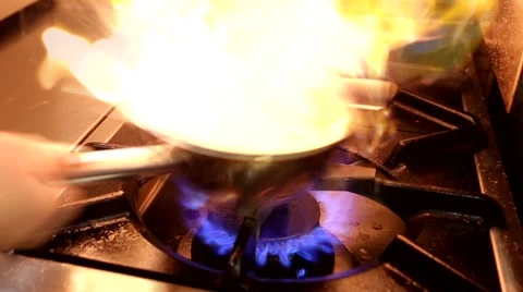Chef In A Restaurant Kitchen Cooking Flambe Style Stock Footage 54202485