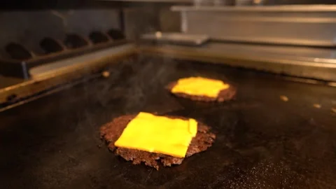 Chef in restaurant kitchen making burger. Fresh meat twisted into minced meat Stock Footage 262449070