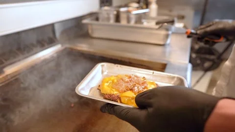 Chef in restaurant kitchen making burger. Fresh meat twisted into minced meat Stock Footage 262449402