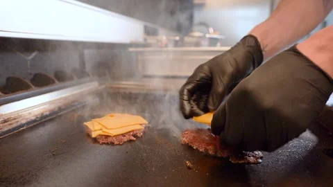 Chef in restaurant kitchen making burger. Fresh meat twisted into minced meat Stock Footage 262450570