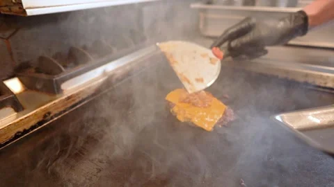 Chef in restaurant kitchen making burger. Fresh meat twisted into minced meat Stock Footage 262450807