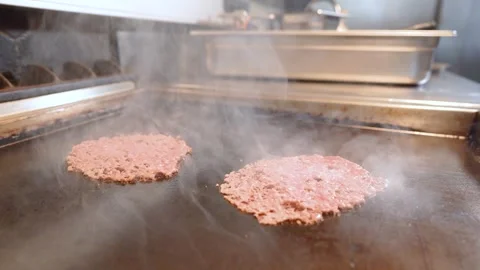 Chef in restaurant kitchen making burger. Fresh meat twisted into minced meat Stock Footage 262553784