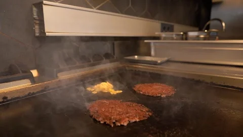 Chef in restaurant kitchen making burger. Fresh meat twisted into minced meat Stock Footage 262959280