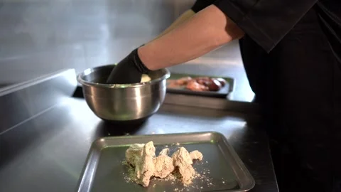 Chef in restaurant kitchen making chicken Stock Footage 262449820