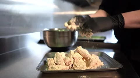 Chef in restaurant kitchen making chicken Stock Footage 262553862