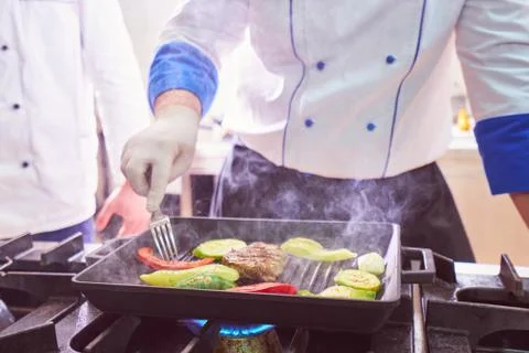 Chef in restaurant kitchen Stock Photos