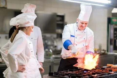 Chef in restaurant kitchen Stock Photos