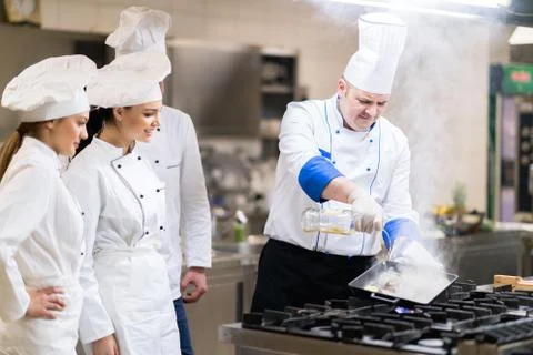 Chef in restaurant kitchen Stock Photos