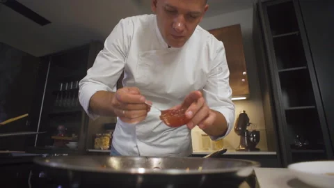 Chef At Restaurant Kitchen Pours Sauce In Dish. Cooking Delicious Food Cuisine. Stock-Footage 142817807