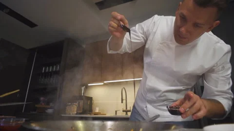 Chef At Restaurant Kitchen Pours Sauce In Frying Pan. Cooking Food Asian Cuisine Stock-Footage 142817864