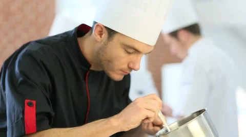 Chef in restaurant kitchen preparing dish Stock Footage 47773507