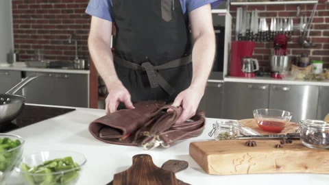 Chef In Restaurant Kitchen Puts Knives and Tools On Table Before Preparing Food. 動画素材 142806973