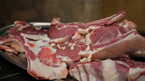 The chef of the restaurant marinates fresh beef Stock Footage 97443834