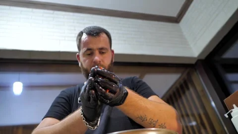 The chef in the restaurant prepares the dish for serving to the table Stock Footage 248055776